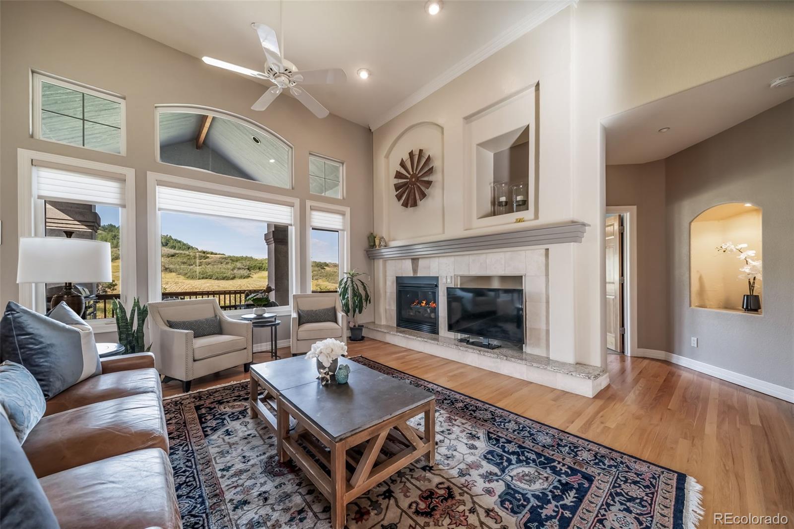 4612 High Spring Road Castle Rock, CO 80104 - Photo 8 of 50 a living room with furniture and a fireplace