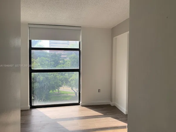 a view of a room that has a large window
