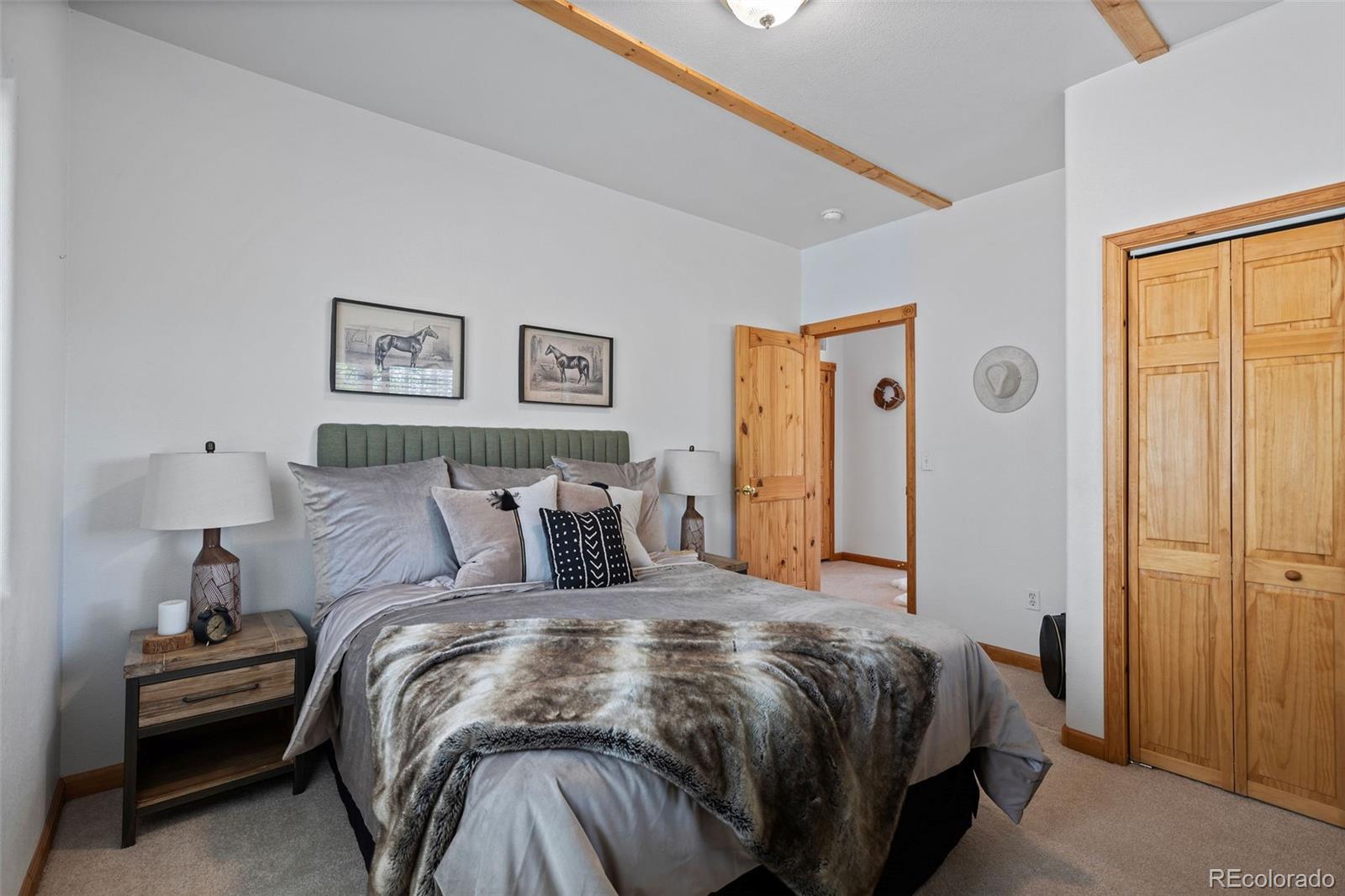 7551 Remington Road Como, CO 80432 - Photo 16 of 35 a bed room with a bed and a lamp
