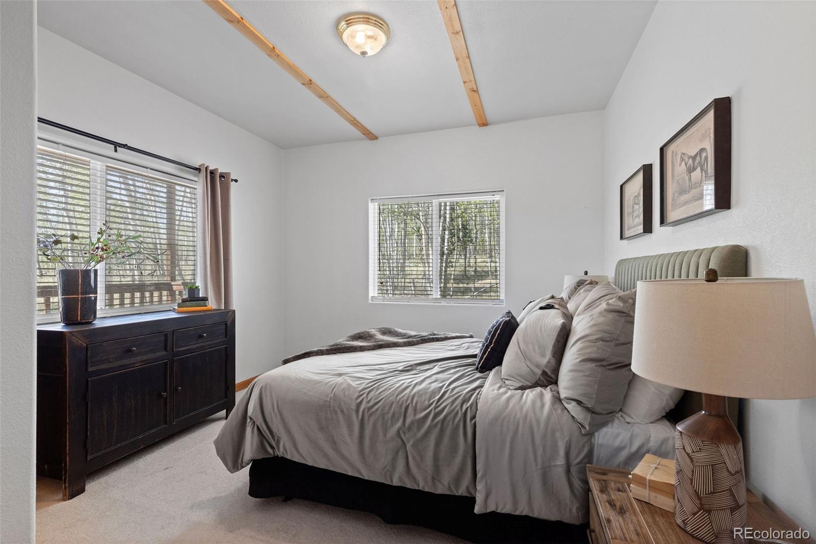 7551 Remington Road Como, CO 80432 - Photo 17 of 35 a bedroom with a bed and a window