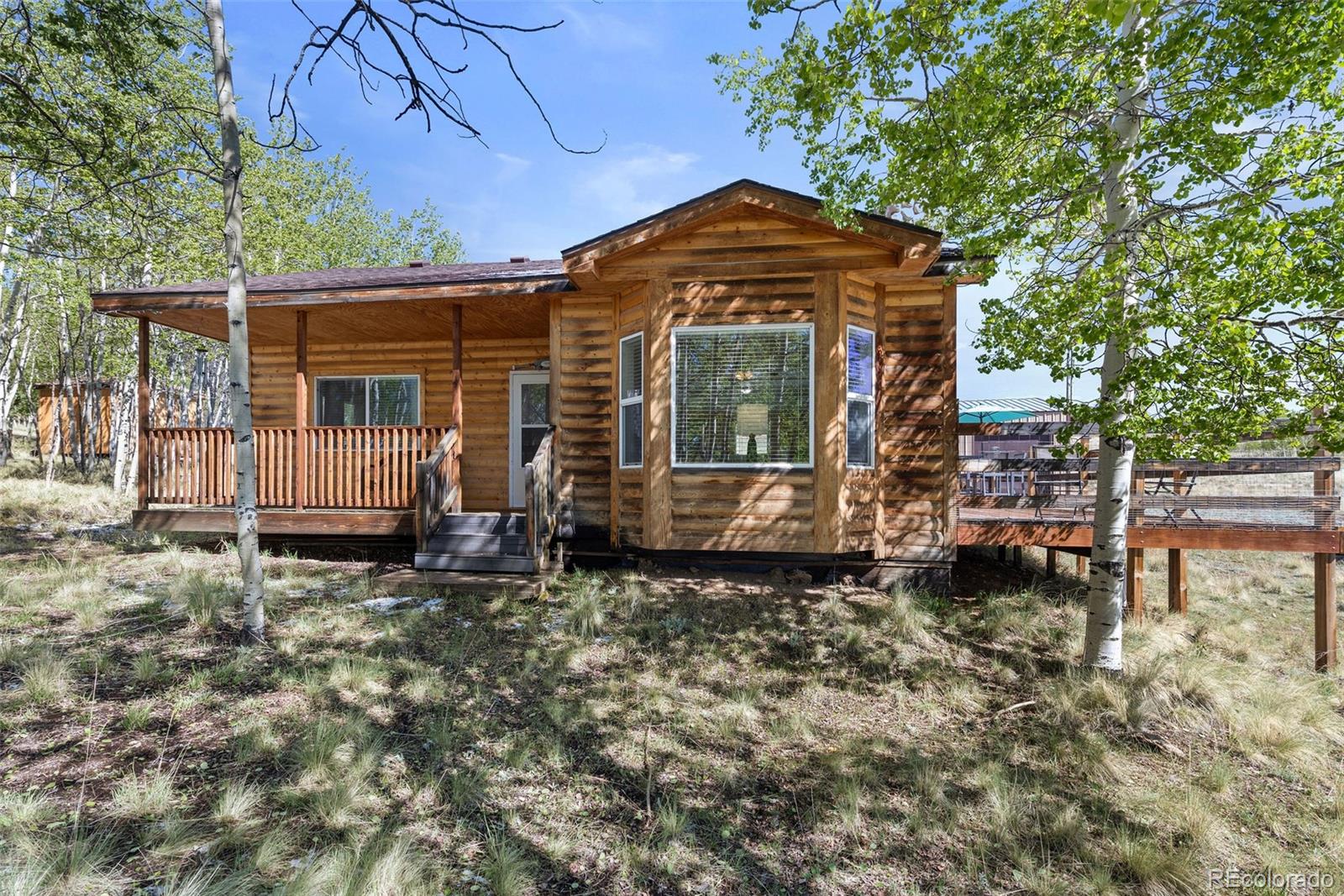 7551 Remington Road Como, CO 80432 - Photo 2 of 35 a view of a house with a yard