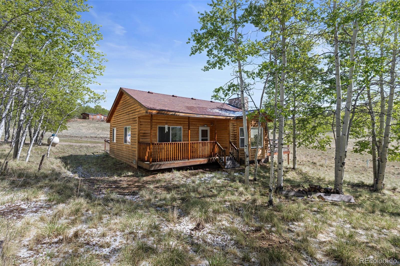 7551 Remington Road Como, CO 80432 - Photo 22 of 35 a front view of a house with a garden