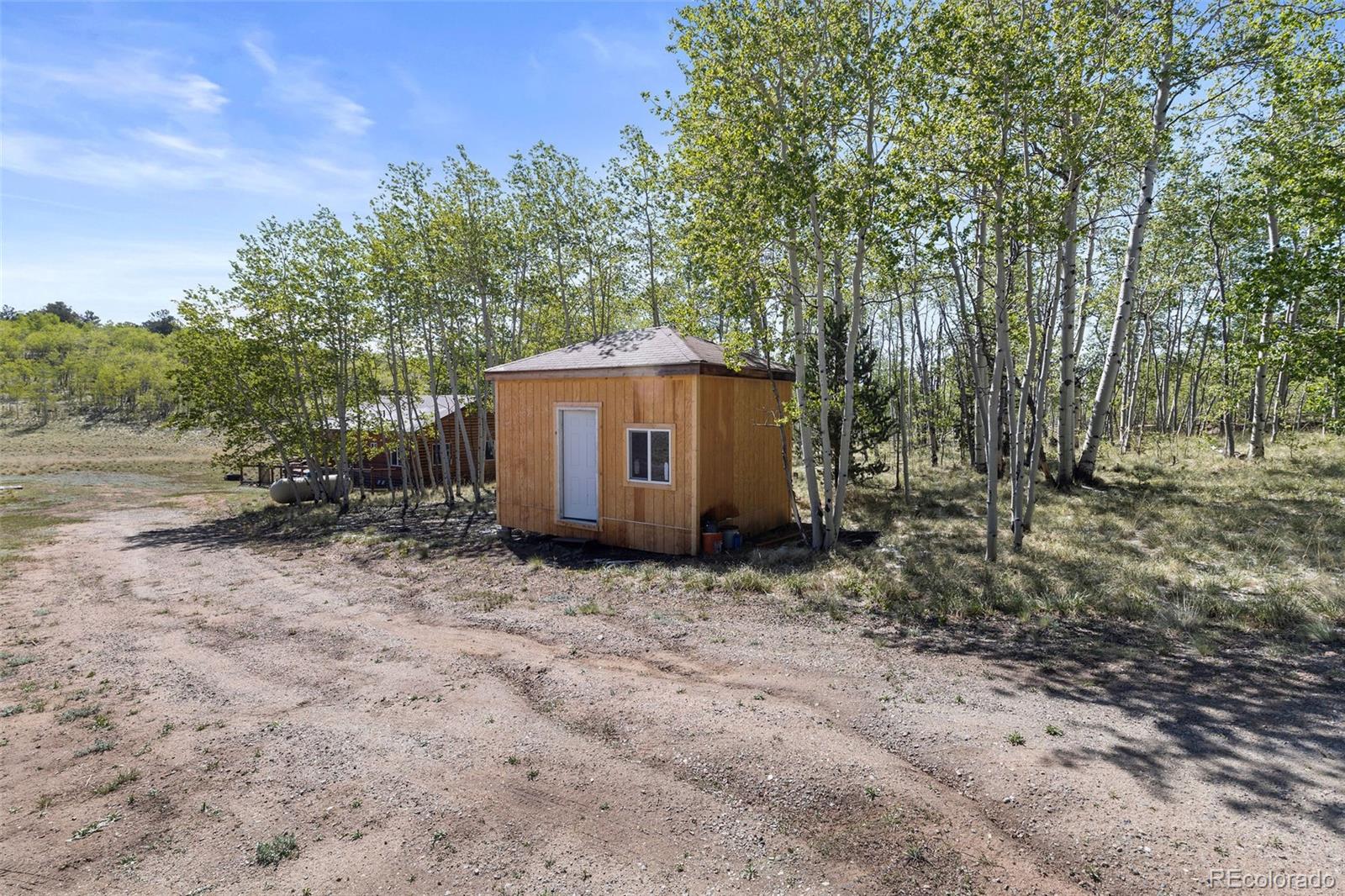 7551 Remington Road Como, CO 80432 - Photo 30 of 35 a view of a barn in the middle of a yard