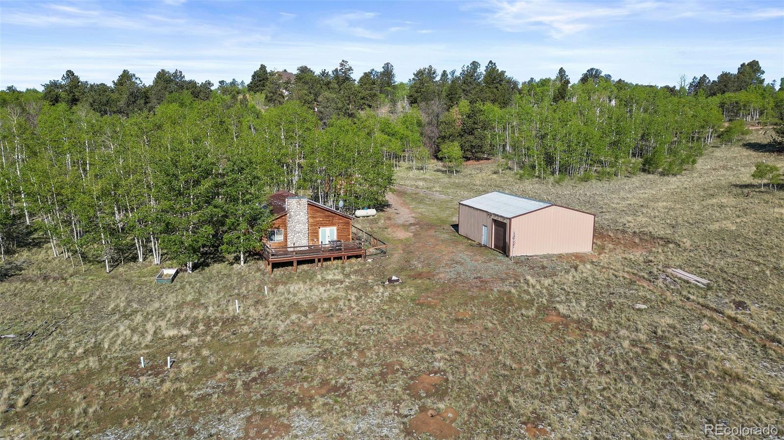 7551 Remington Road Como, CO 80432 - Photo 3 of 35 a backyard of a house with lots of green space