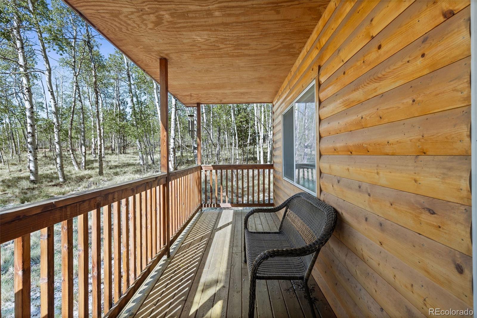 7551 Remington Road Como, CO 80432 - Photo 5 of 35 a view of balcony with wooden floor and outdoor seating