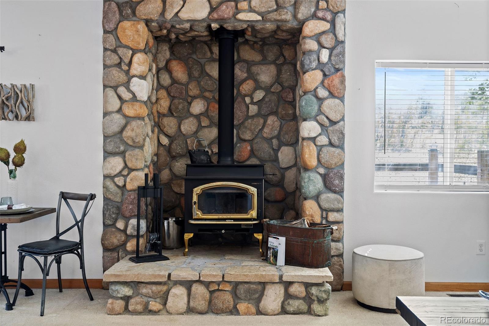 7551 Remington Road Como, CO 80432 - Photo 9 of 35 a living room with a couch and a fireplace