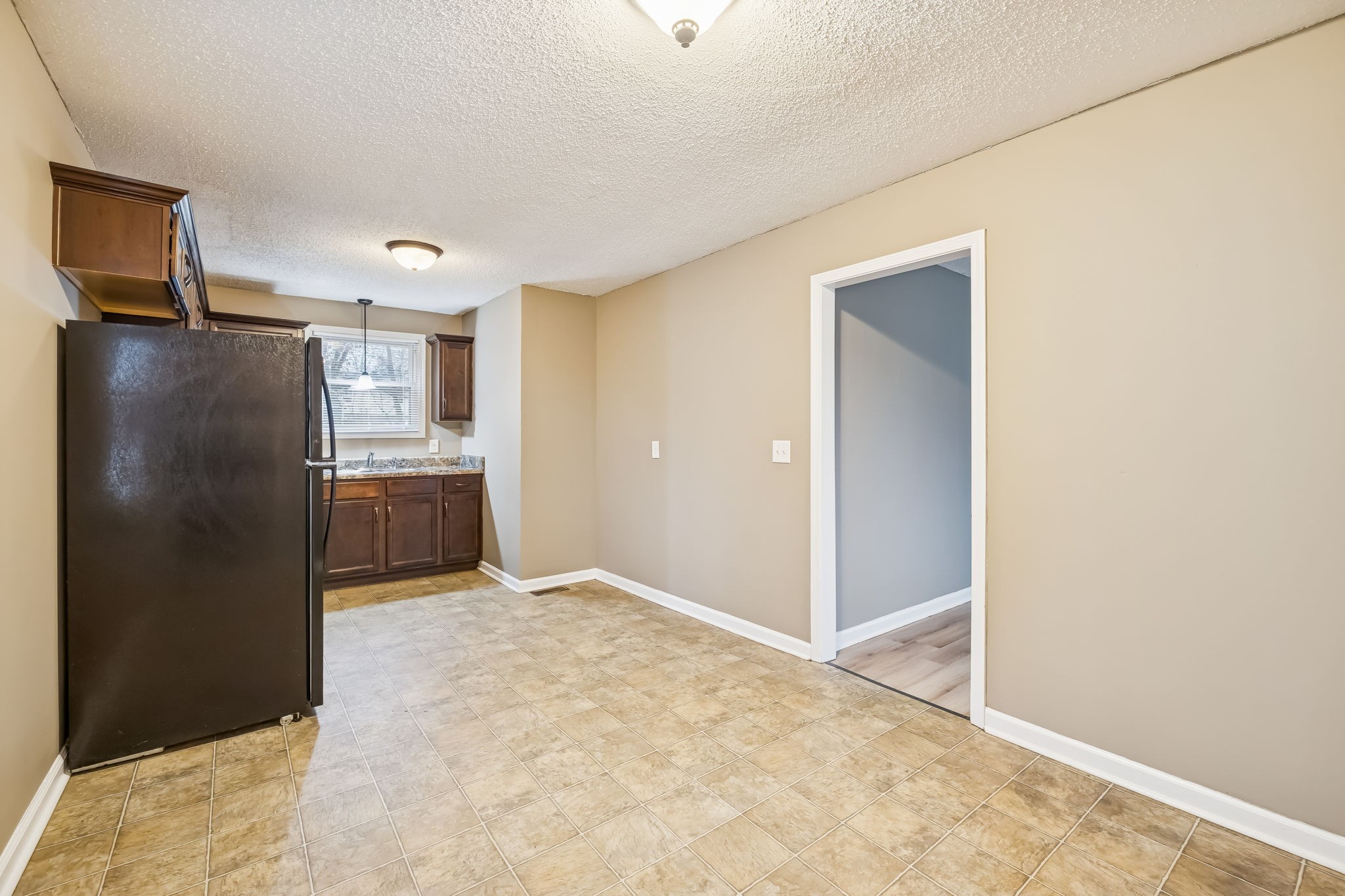 236 Tobacco Road Clarksville, TN 37042 - Photo 12 of 27 a view of a kitchen with refrigerator cabinets and a sink