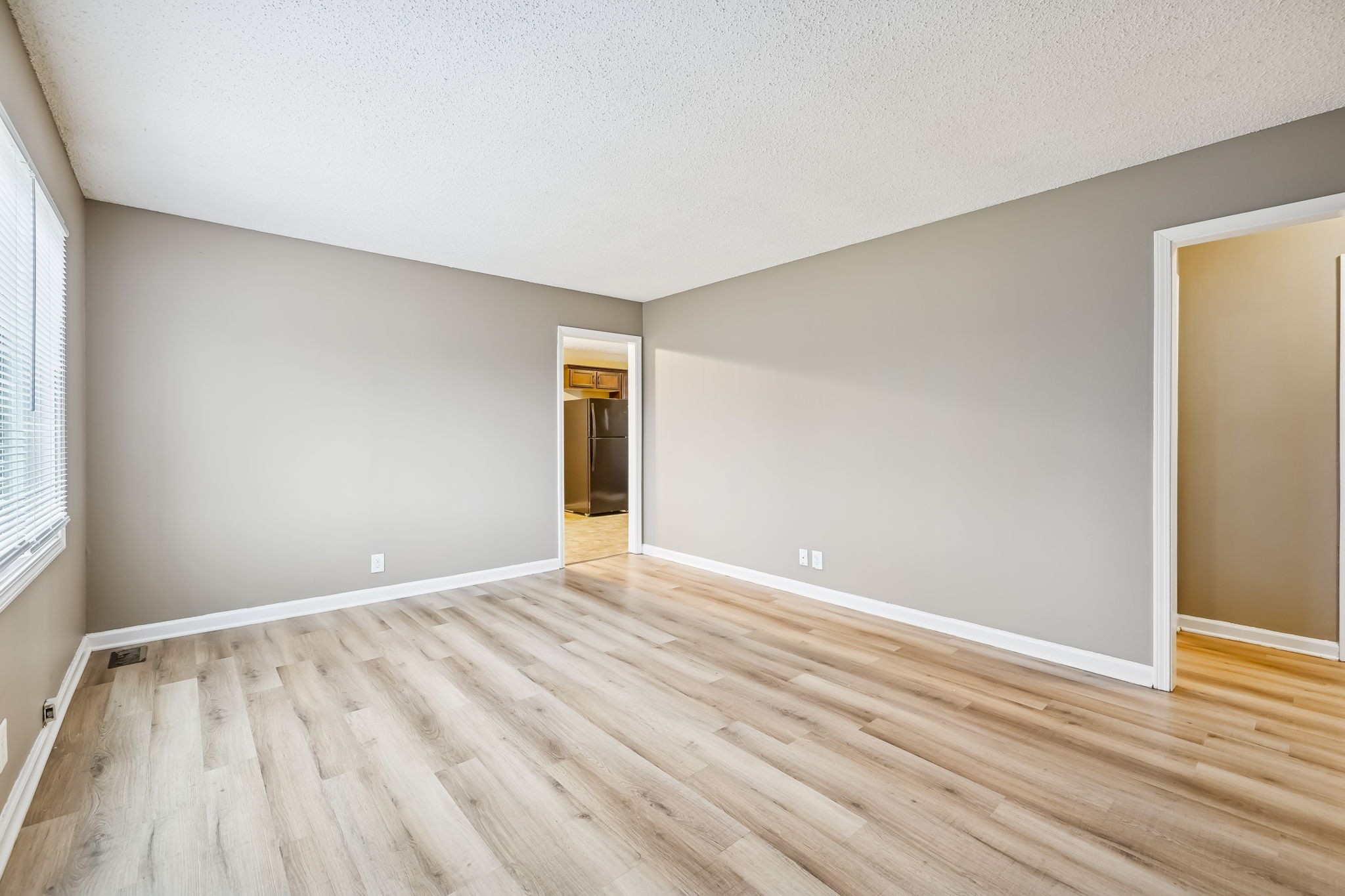 236 Tobacco Road Clarksville, TN 37042 - Photo 8 of 27 a view of an empty room with wooden floor