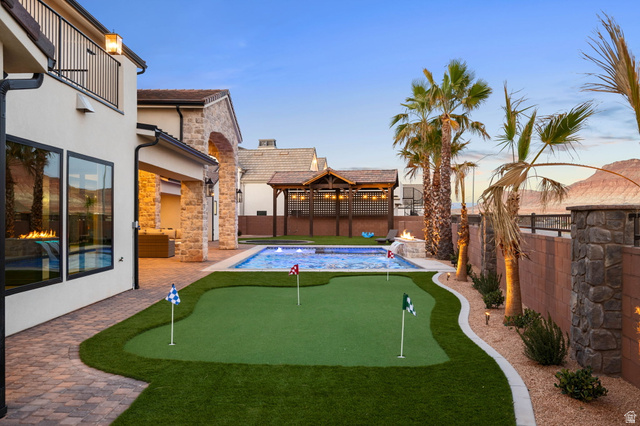 4871 South Homestead Way Washington, UT 84780 - Photo 112 of 151 Fenced backyard with a patio and a putting area