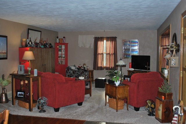 4255 East Flagg Road Ashton, IL 61006 - Photo 3 of 25 a living room with furniture and a flat screen tv