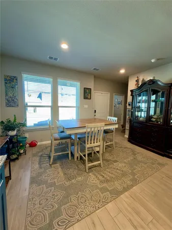 a large kitchen with stainless steel appliances granite countertop a stove a sink dishwasher and a refrigerator