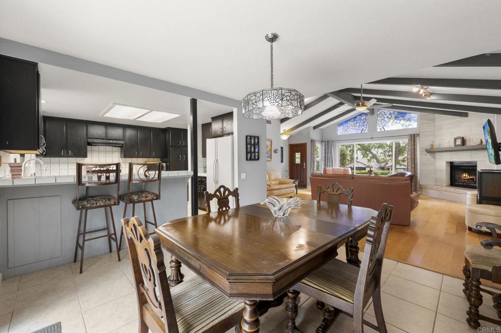 1402 Rimrock Drive Escondido, CA 92027 - Photo 24 of 69 a view of a dining room and livingroom with furniture wooden floor a chandelier