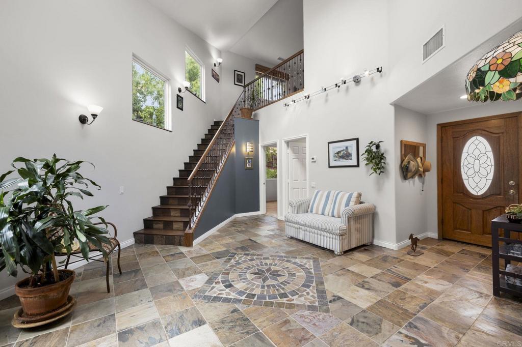 1402 Rimrock Drive Escondido, CA 92027 - Photo 31 of 69 a living room with furniture and a potted plant