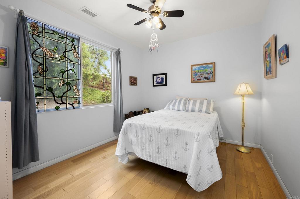 1402 Rimrock Drive Escondido, CA 92027 - Photo 33 of 69 a bedroom with a bed and a window