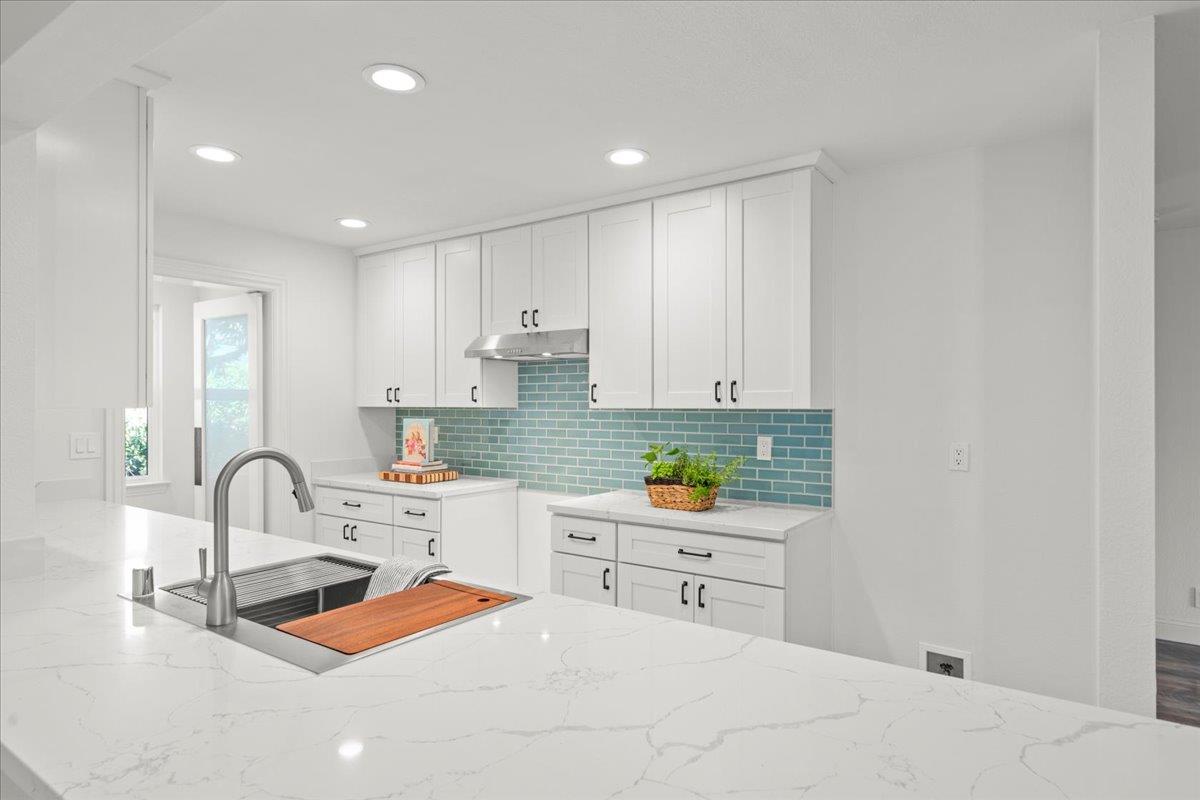 3306 Leavesley Road Gilroy, CA 95020 - Photo 19 of 60 a kitchen with a sink and a stove top oven