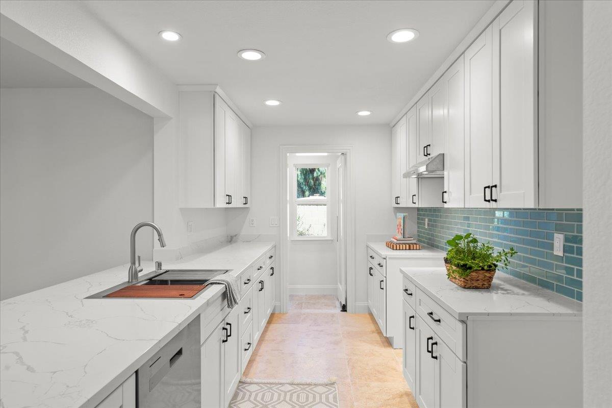 3306 Leavesley Road Gilroy, CA 95020 - Photo 20 of 60 a kitchen with a sink stove and cabinets