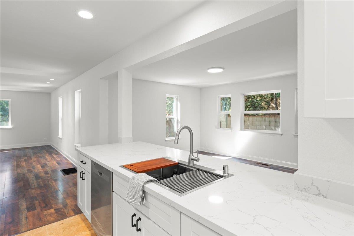 3306 Leavesley Road Gilroy, CA 95020 - Photo 23 of 60 a kitchen with a sink cabinets and appliances