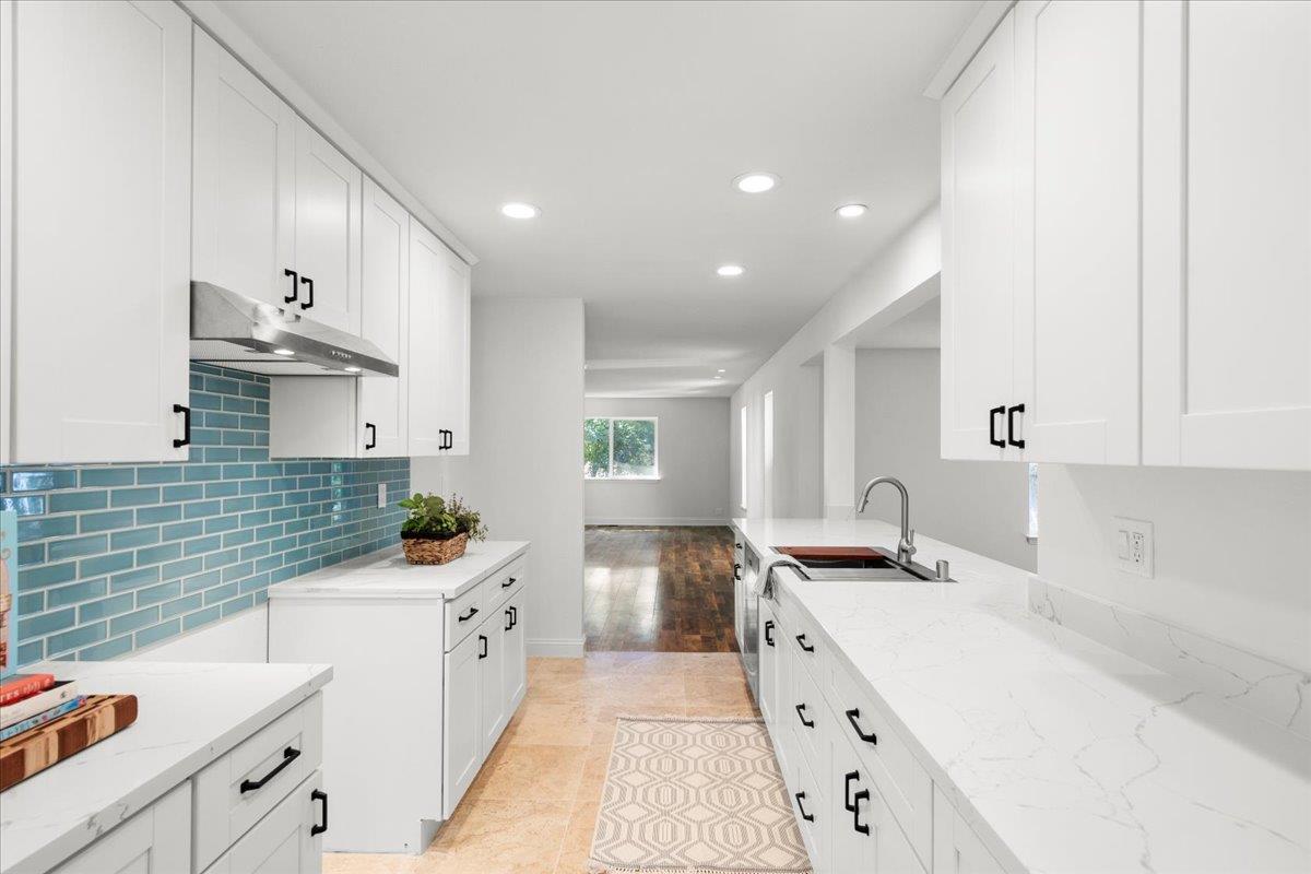 3306 Leavesley Road Gilroy, CA 95020 - Photo 24 of 60 a kitchen with a sink stove and cabinets