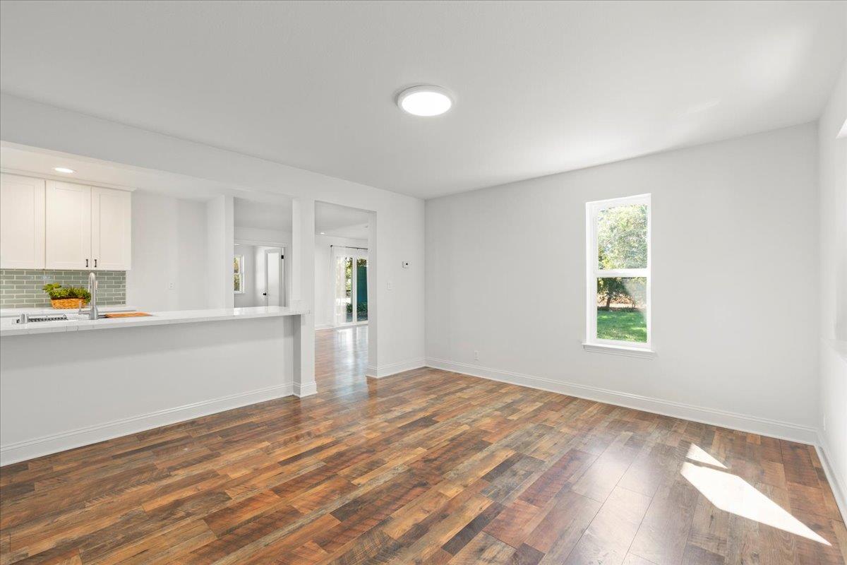 3306 Leavesley Road Gilroy, CA 95020 - Photo 26 of 60 a view of empty room with wooden floor and fan