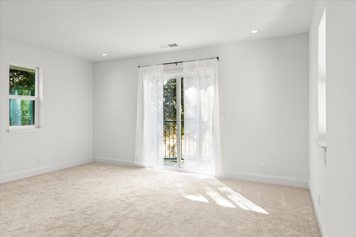 3306 Leavesley Road Gilroy, CA 95020 - Photo 31 of 60 an empty room with windows and closet