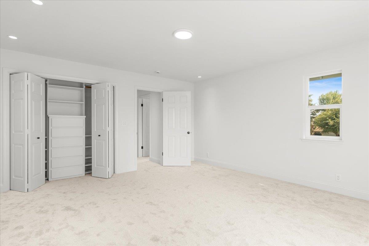 3306 Leavesley Road Gilroy, CA 95020 - Photo 32 of 60 an empty room with closet and windows