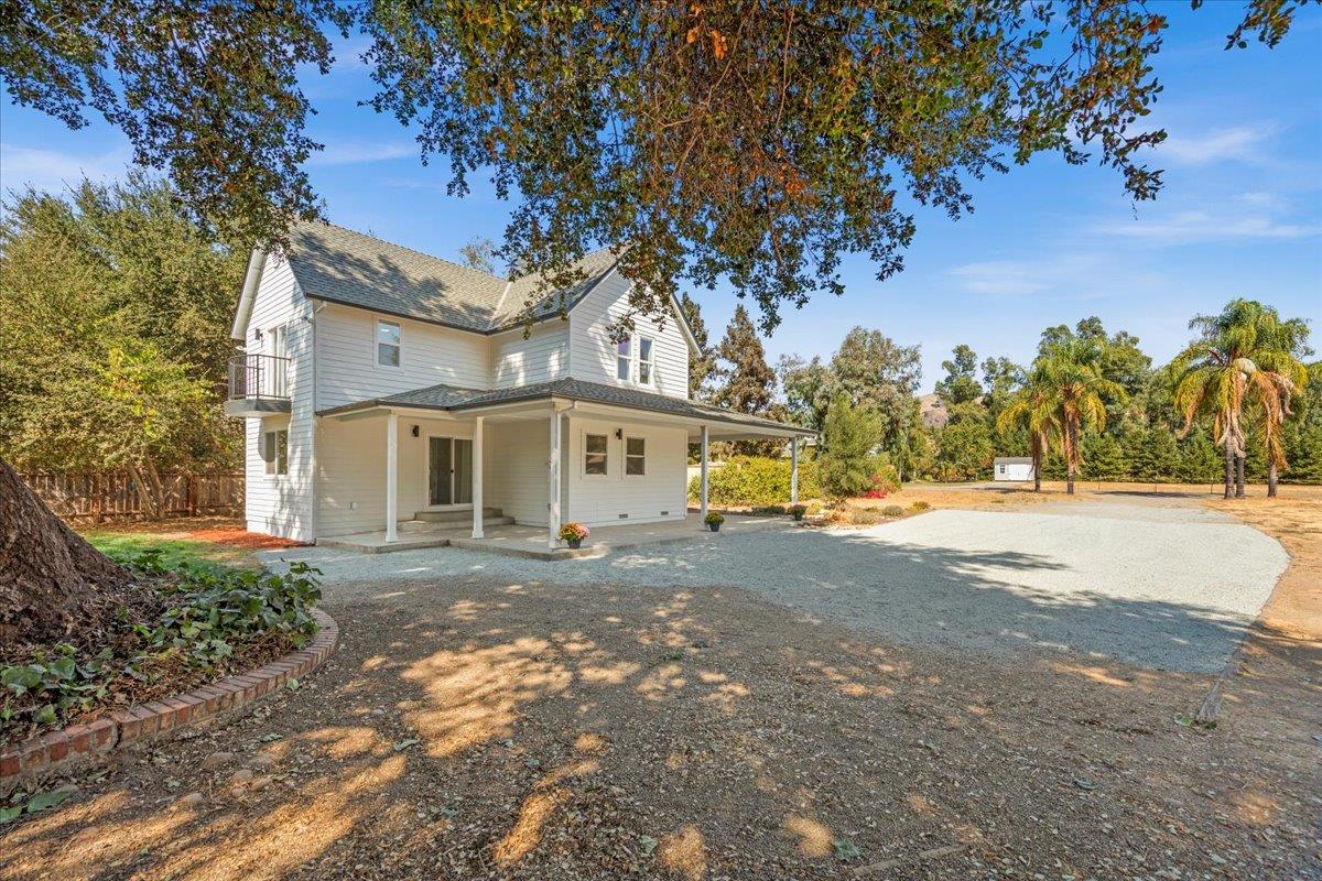 3306 Leavesley Road Gilroy, CA 95020 - Photo 4 of 60 a view of a large tree in front of a house
