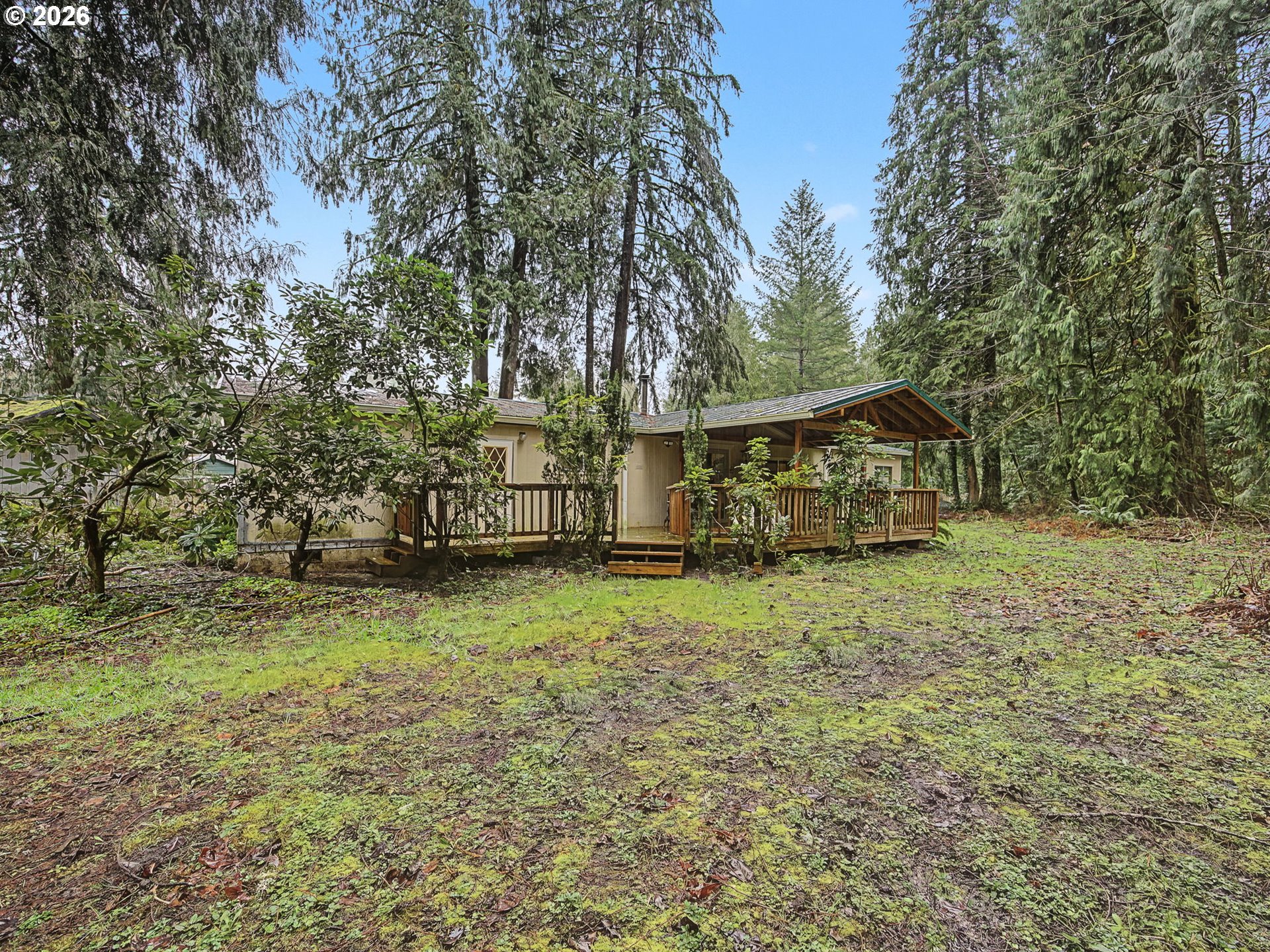 41180 Southeast Kubitz Road Sandy, OR 97055 - Photo 32 of 35 a view of house with backyard and trees