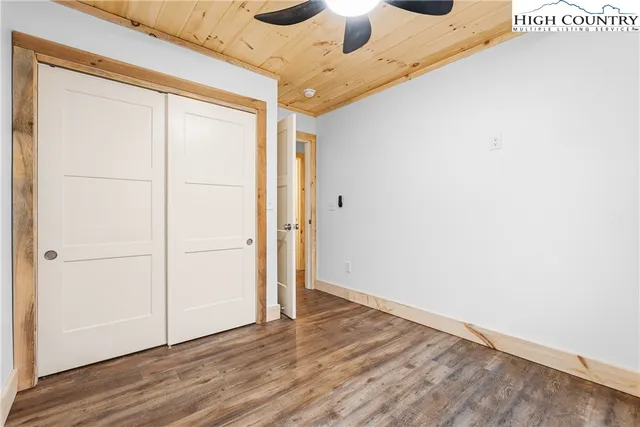 a view of a hallway view with wooden floor and staircase