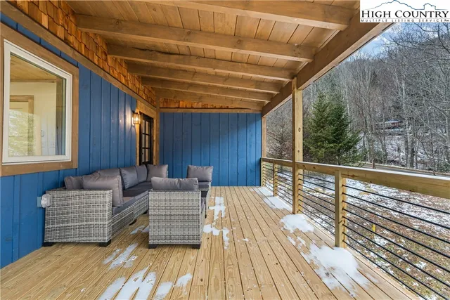 a view of balcony with wooden floor and outdoor space