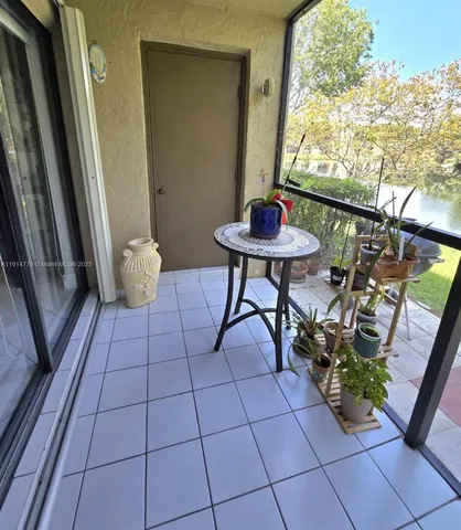 a view of a terrace with furniture and garden