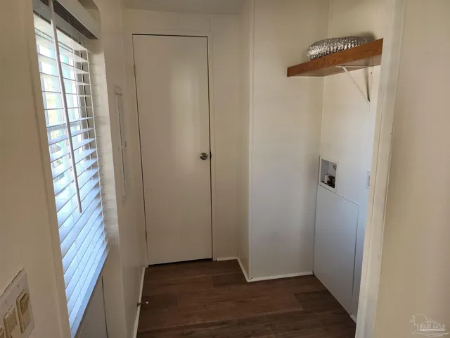 a view of an entryway with wooden floor
