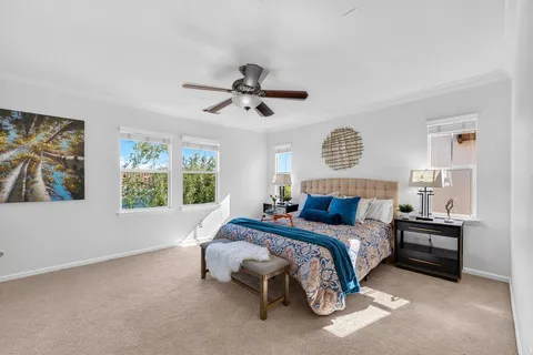a bed room with a bed and a chandelier