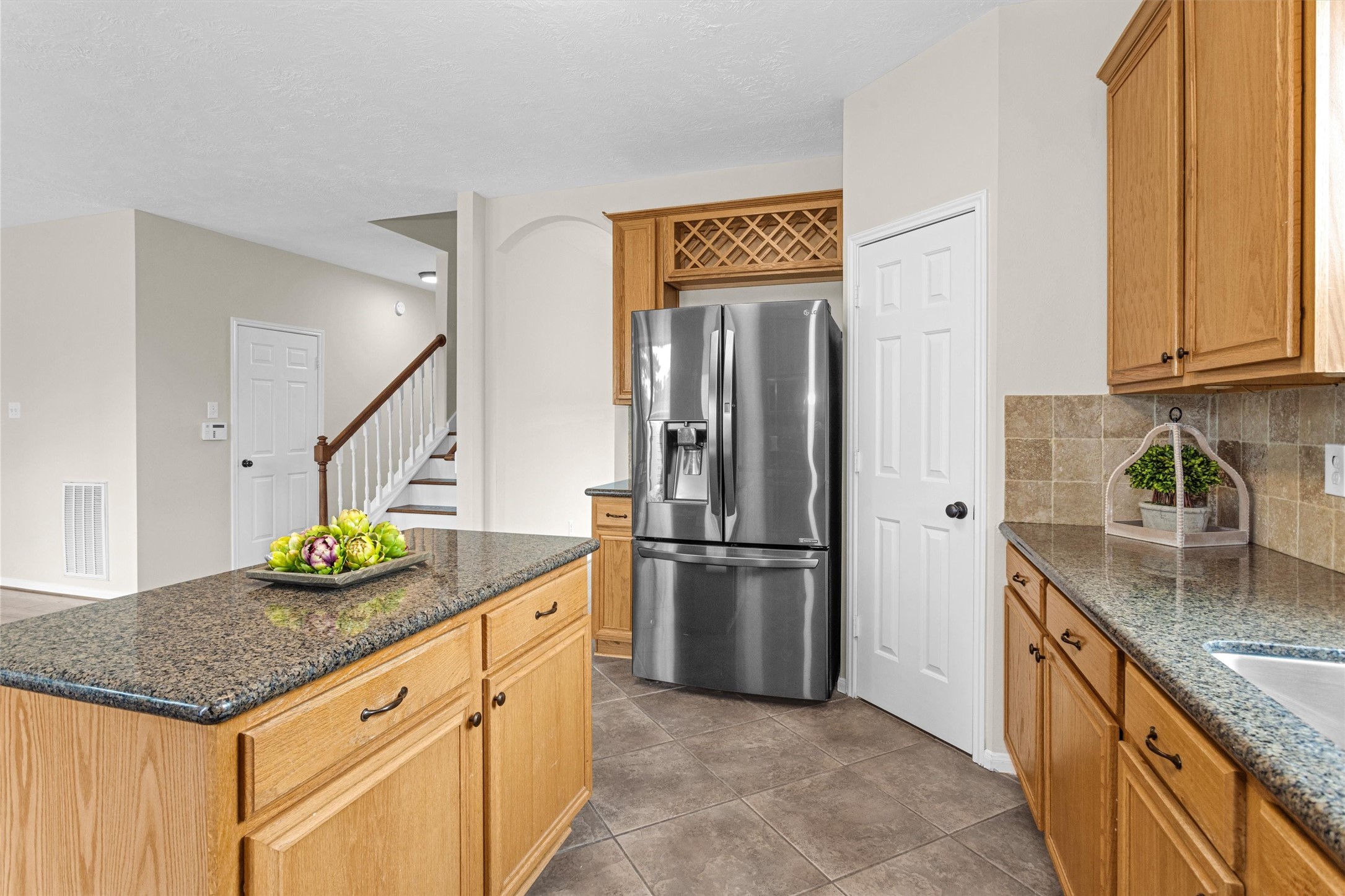 7419 Alderly Drive Spring, TX 77389 - Photo 17 of 49 a kitchen with refrigerator and cabinets
