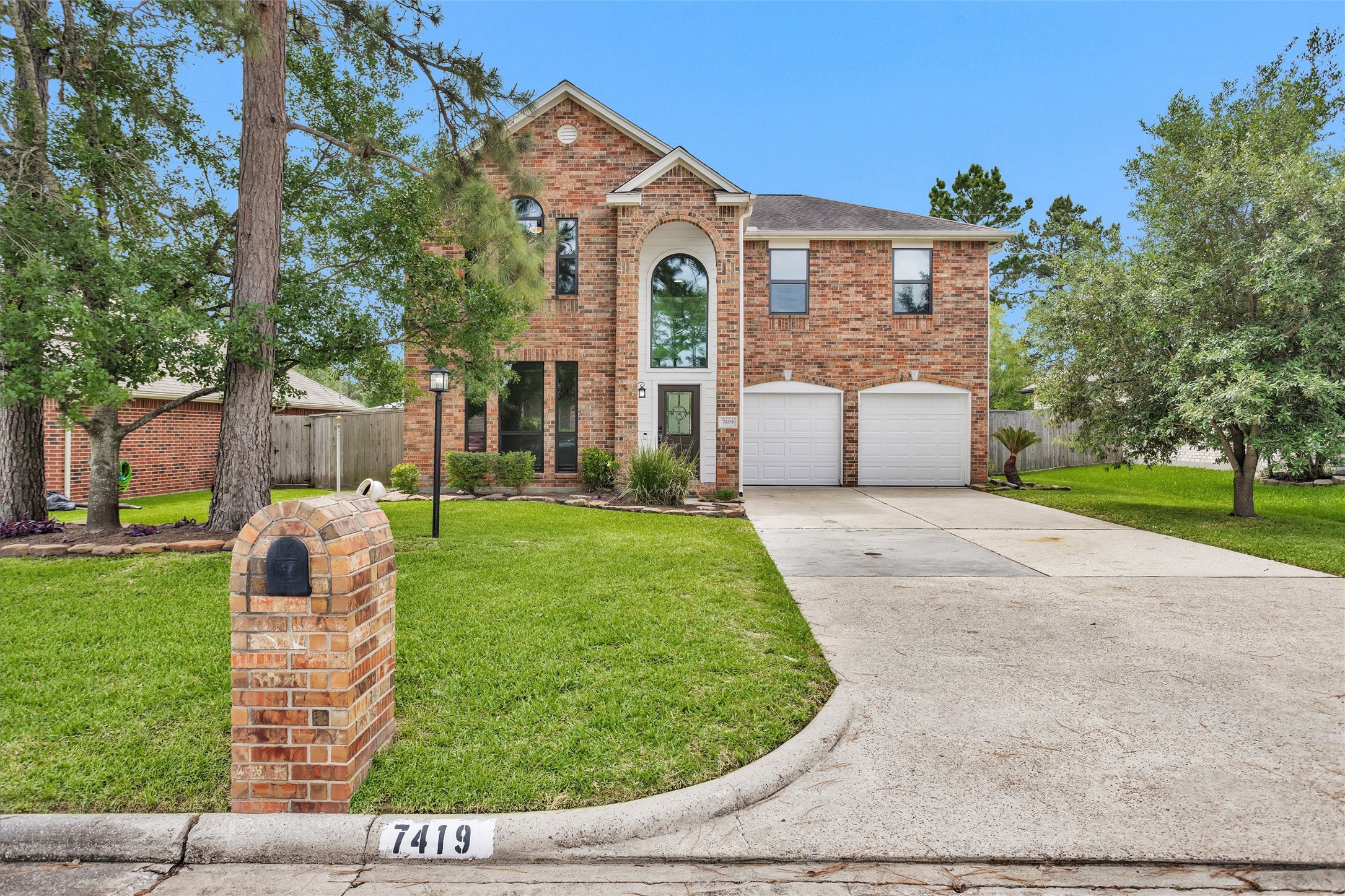 7419 Alderly Drive Spring, TX 77389 - Photo 2 of 49 a front view of a house with a yard