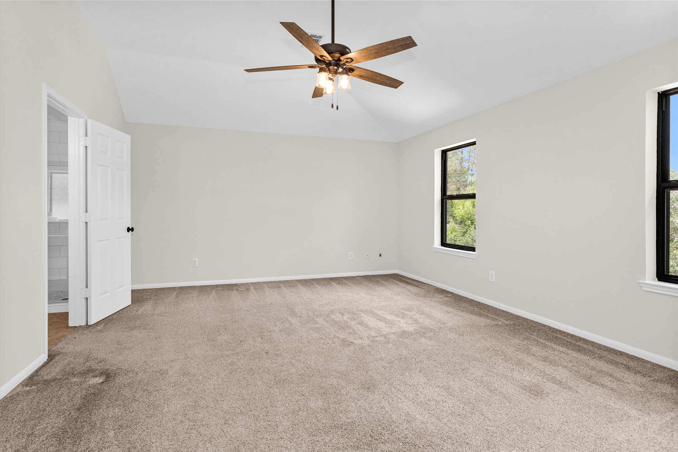 7419 Alderly Drive Spring, TX 77389 - Photo 21 of 49 an empty room with windows and fan