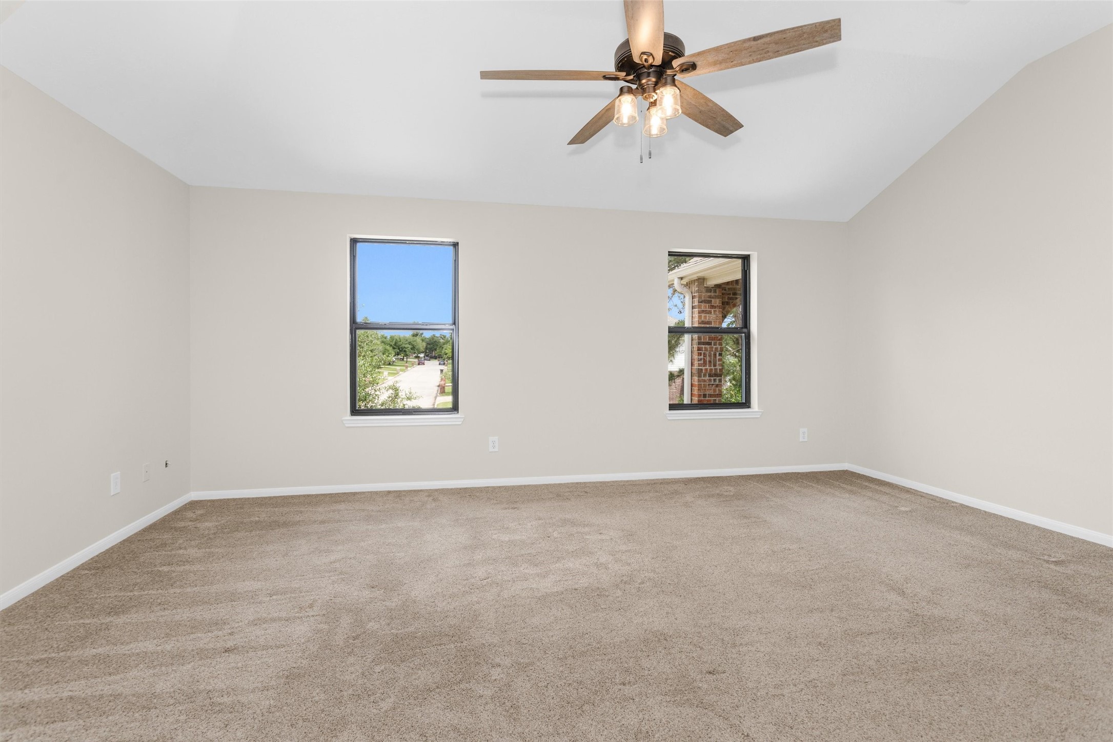 7419 Alderly Drive Spring, TX 77389 - Photo 23 of 49 an empty room with windows and fan