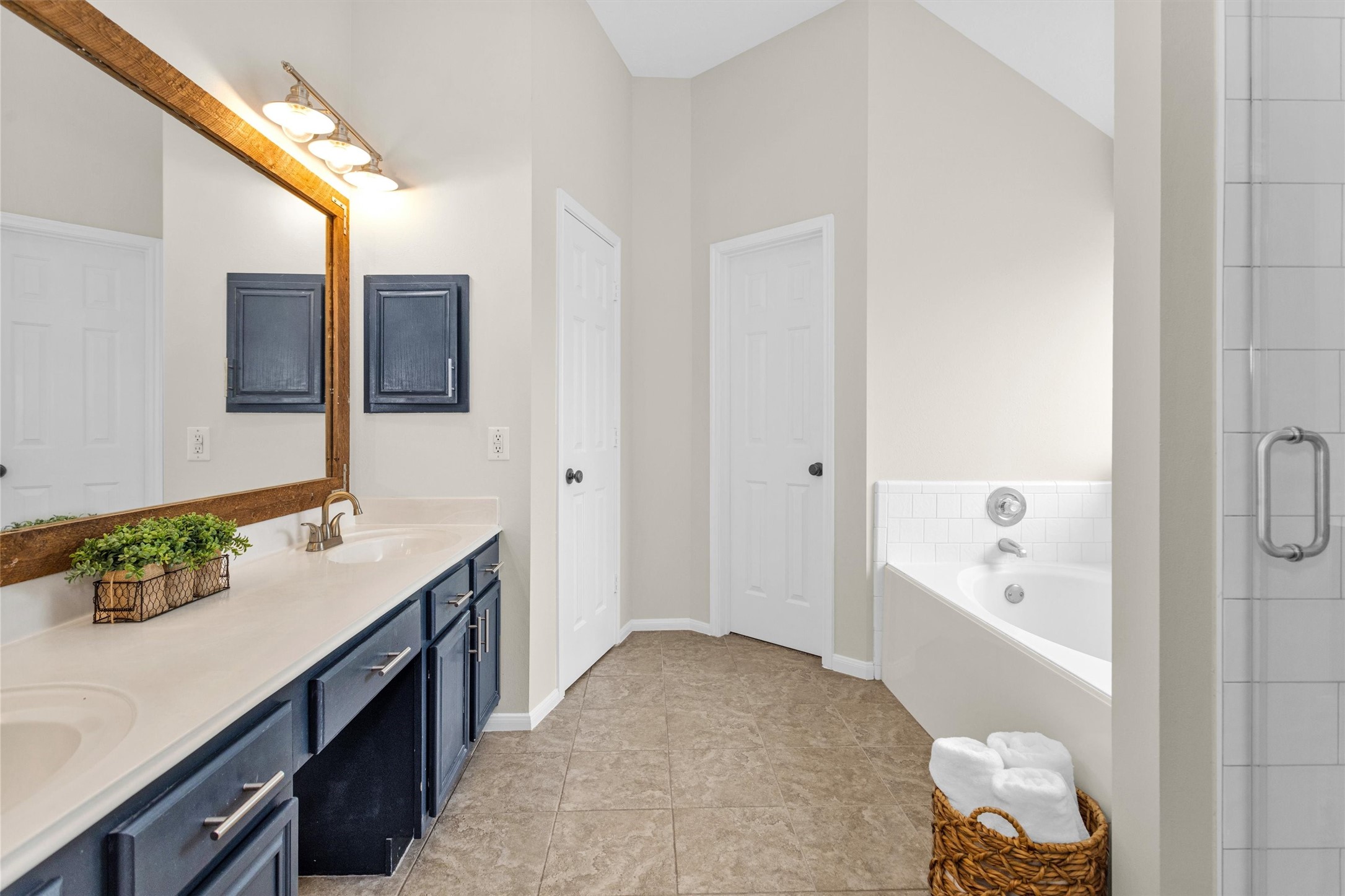 7419 Alderly Drive Spring, TX 77389 - Photo 24 of 49 a en suite bathroom with a granite countertop sink and a bathtub
