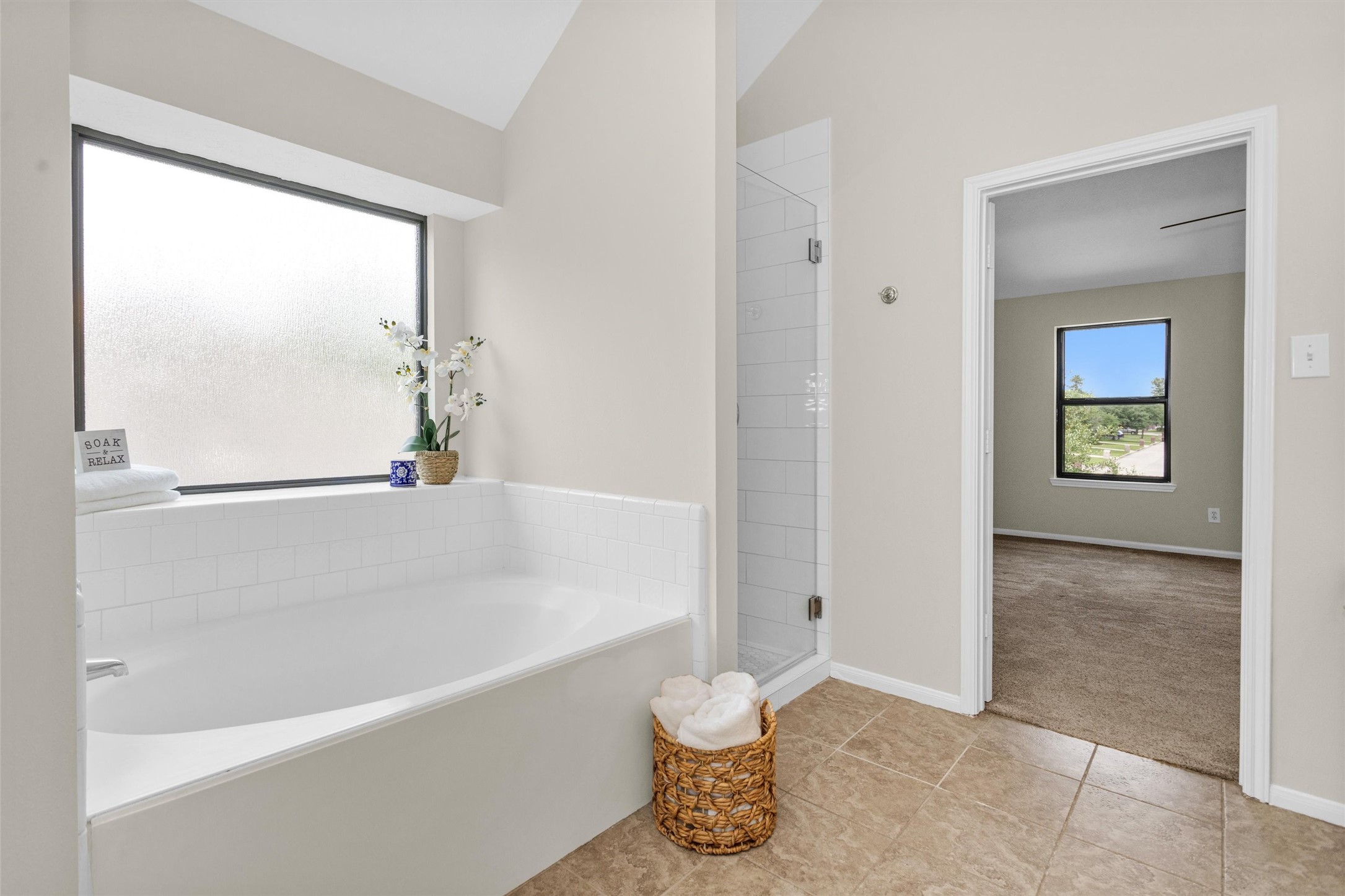 7419 Alderly Drive Spring, TX 77389 - Photo 26 of 49 a bathroom with a bathtub and a shower
