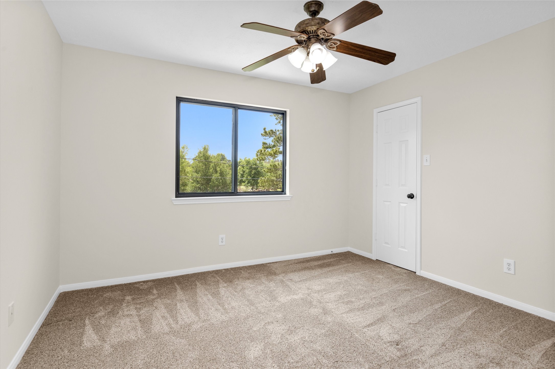 7419 Alderly Drive Spring, TX 77389 - Photo 29 of 49 an empty room with windows and fan