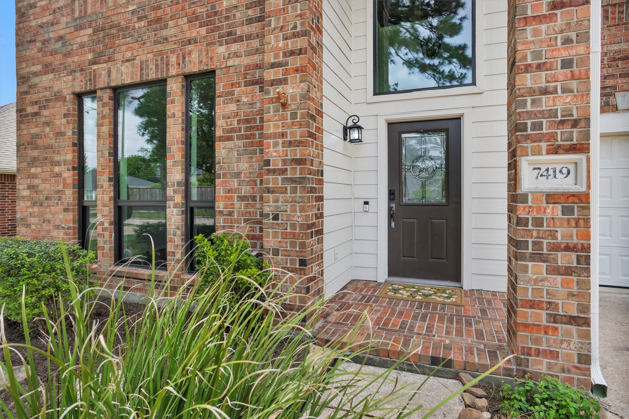 7419 Alderly Drive Spring, TX 77389 - Photo 3 of 49 a view of a brick house with a large window