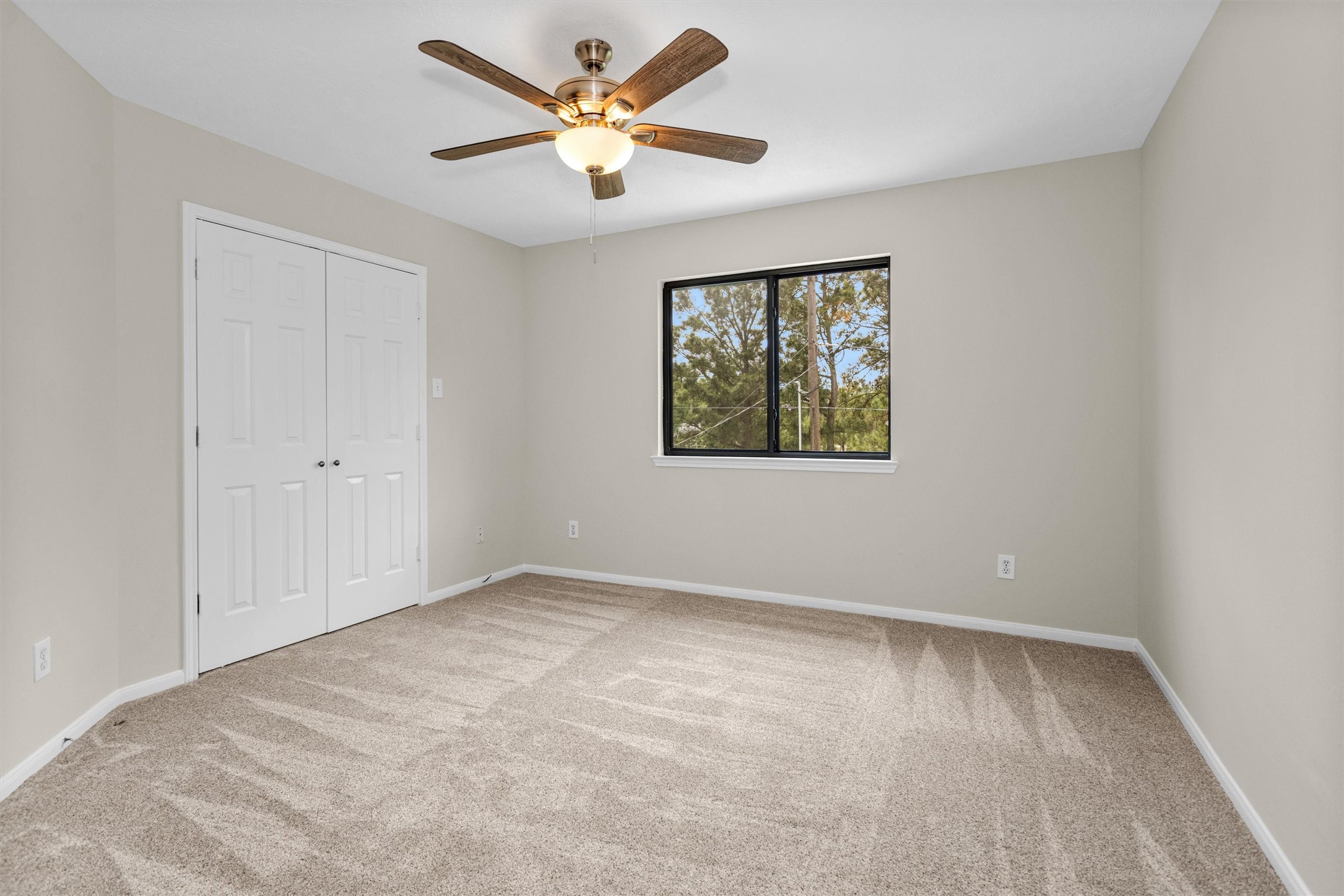7419 Alderly Drive Spring, TX 77389 - Photo 32 of 49 an empty room with windows and fan