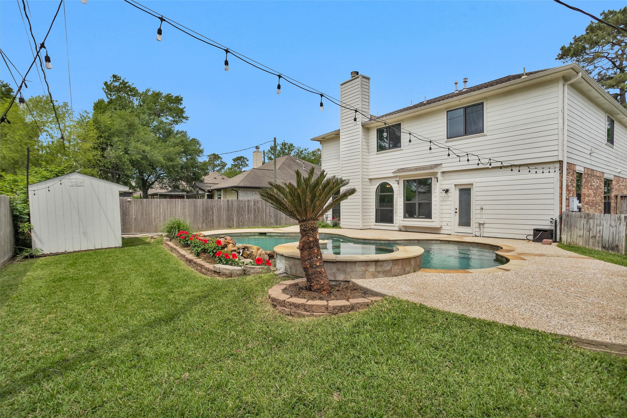 7419 Alderly Drive Spring, TX 77389 - Photo 38 of 49 a front view of a house with garden and tree