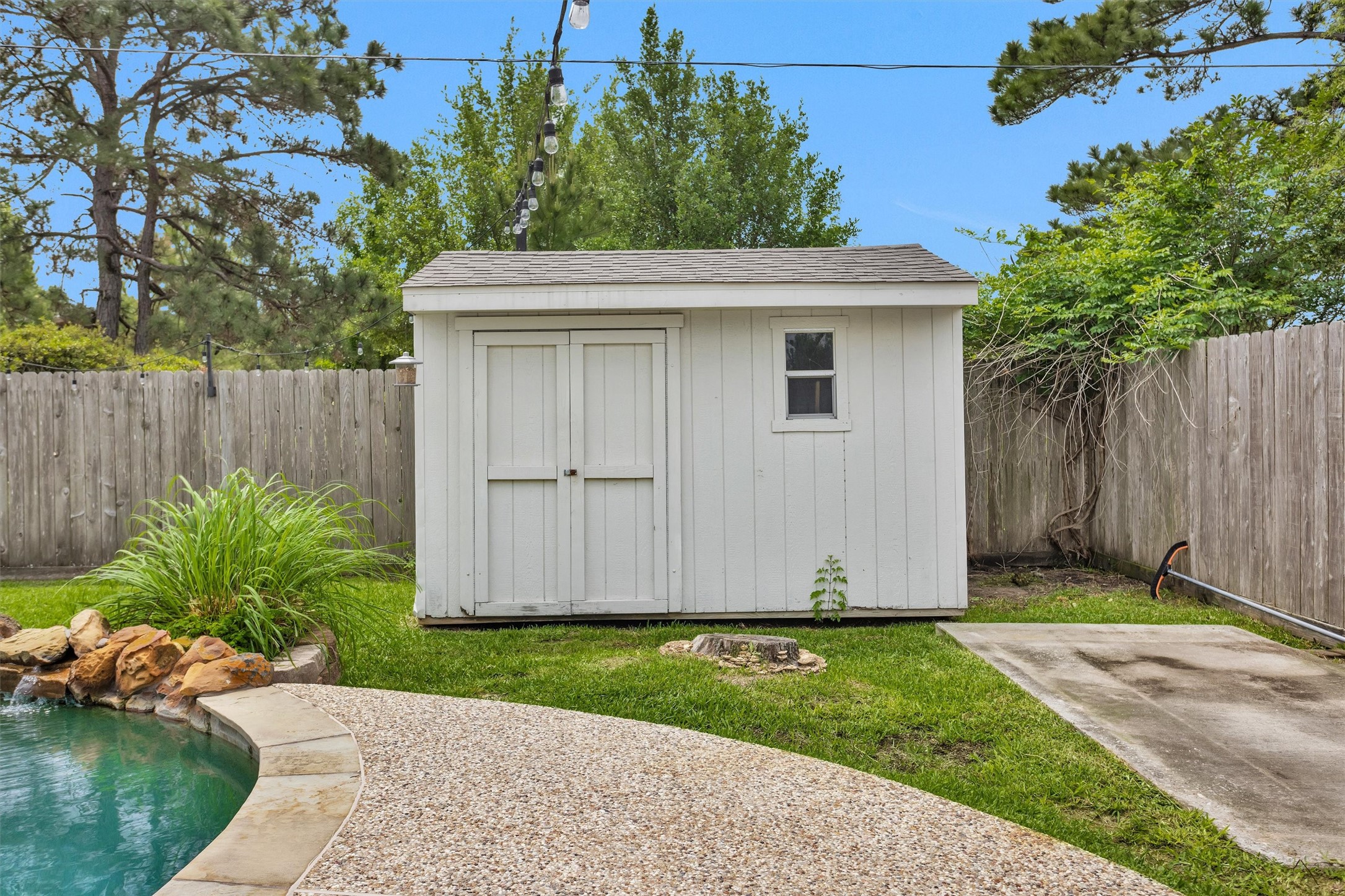 7419 Alderly Drive Spring, TX 77389 - Photo 41 of 49 a view of backyard with potted plants and wooden fence
