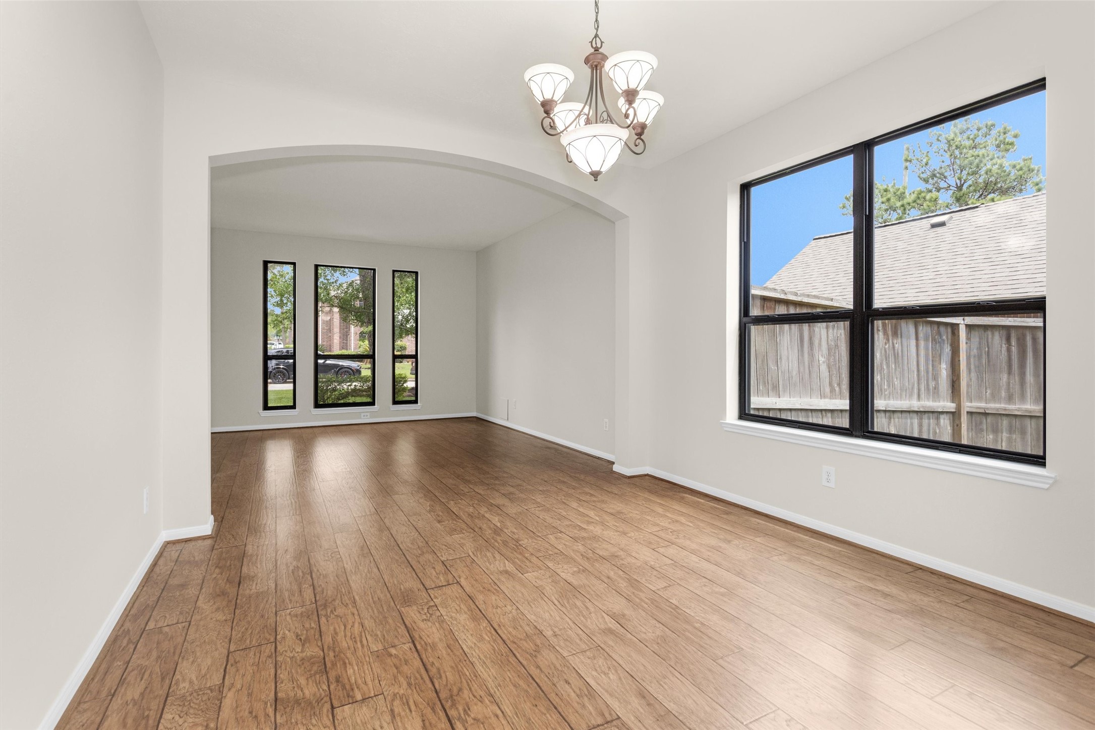 7419 Alderly Drive Spring, TX 77389 - Photo 10 of 49 a view of an empty room with wooden floor and a window