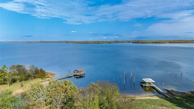 a view of a lake with a yard