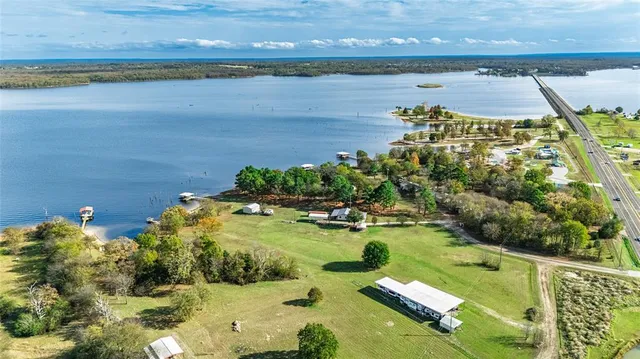a view of a lake with a yard