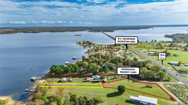 a view of a swimming pool with an outdoor space and seating area