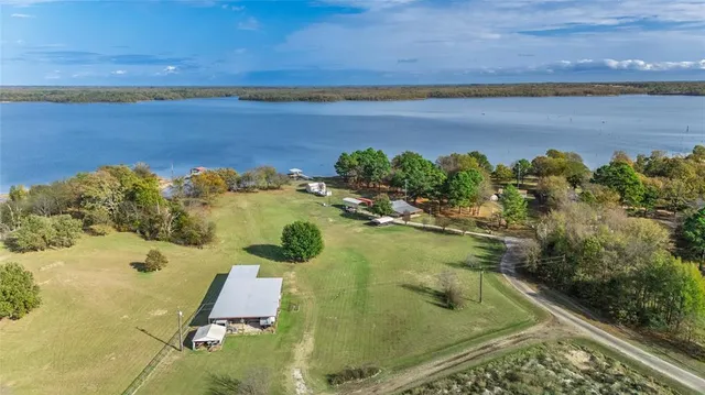 a view of a lake with a yard