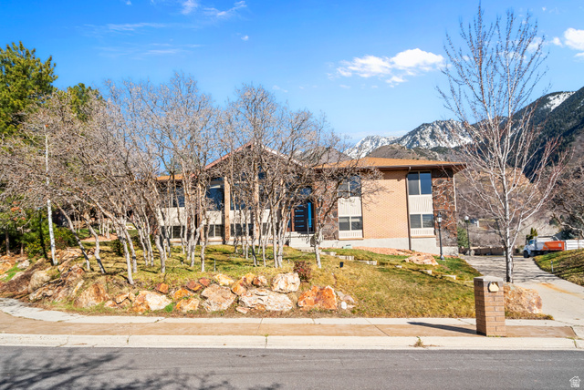 11683 South 2460th Street East Sandy, UT 84092 - Photo 1 of 1 View of front of house with brick siding and a mountain view