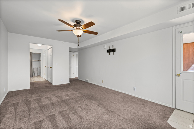 2244 North Canyon Road, Unit 212 Provo, UT 84604 - Photo 16 of 31 Carpeted flooring, ceiling fan with integrated lighting, wall-mounted fixture, and white interior doors